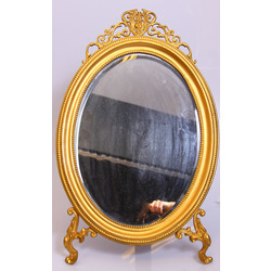 Oval mirror in a metal frame