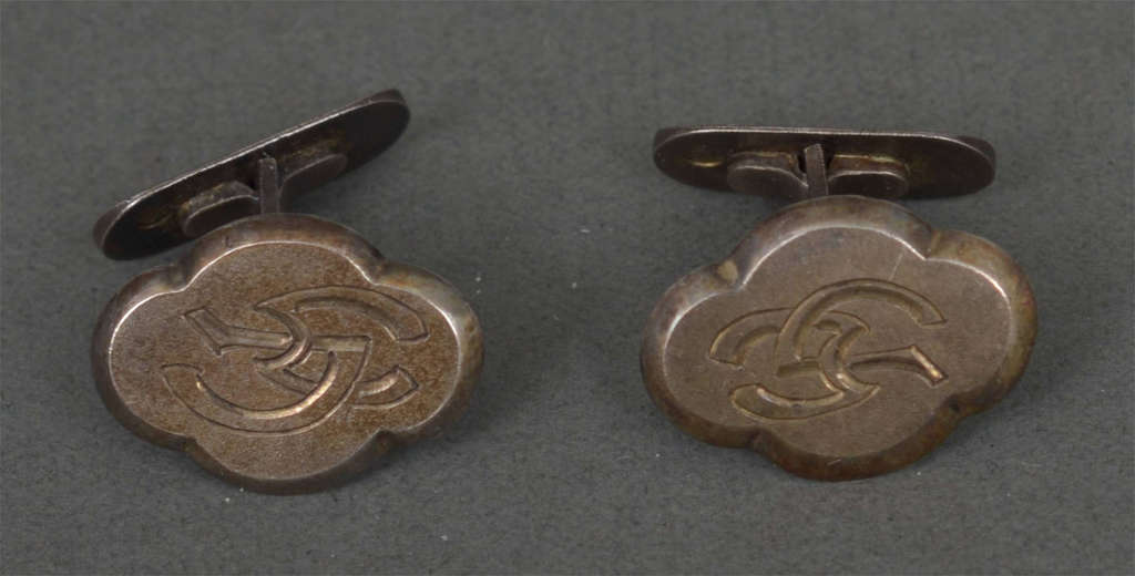 Silver cufflinks with initials V.M.