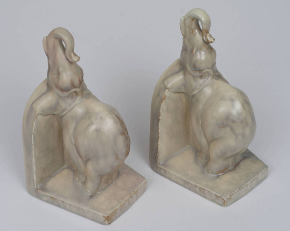 A pair of faience book holders 