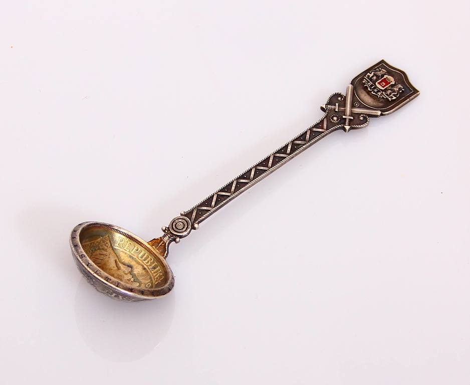 Silver spoon with Riga coat of arms and five-lats coin