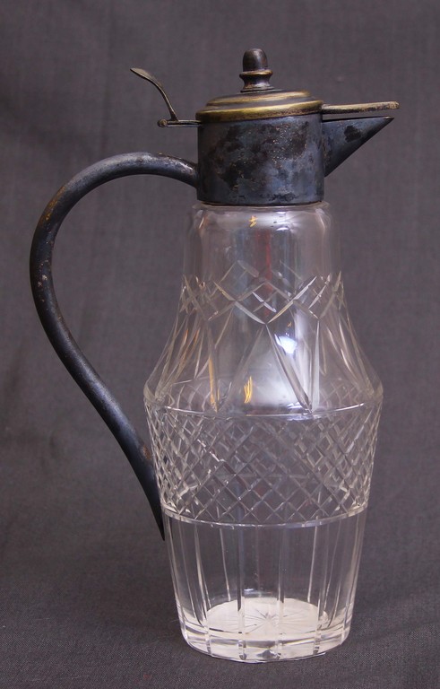 Polished glass carafe with metal finish