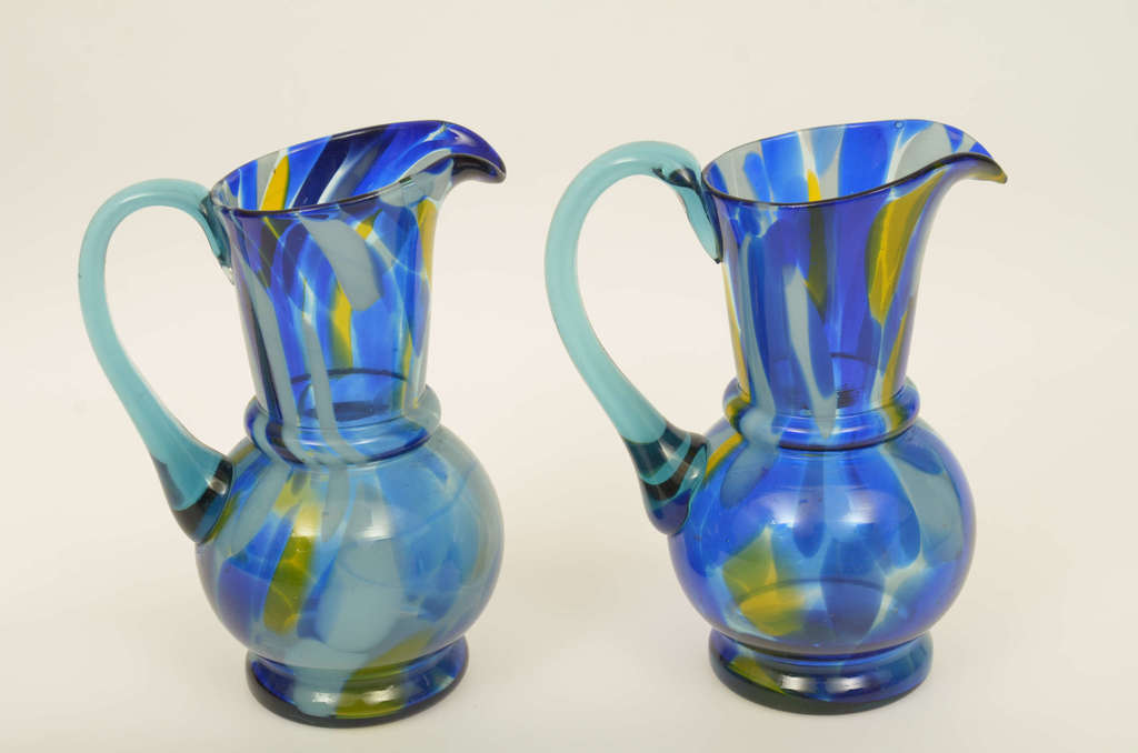 Two colored glass milk jugs