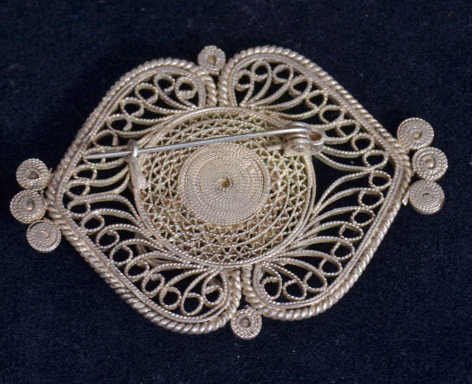 Silver containing brooch