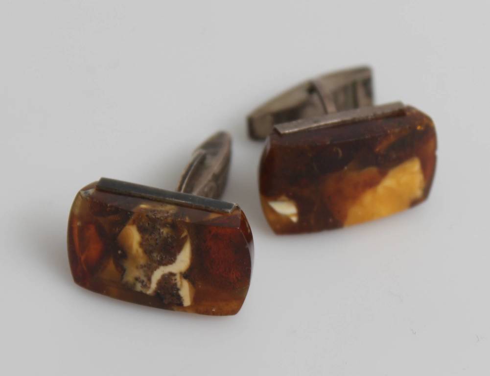 Silver cufflinks with embedded amber
