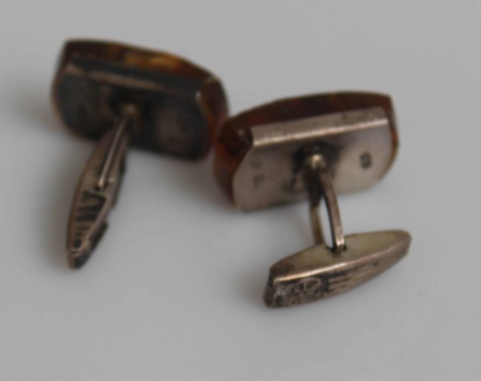 Silver cufflinks with embedded amber