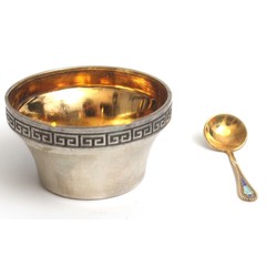 Silver spice bowl with a spoon