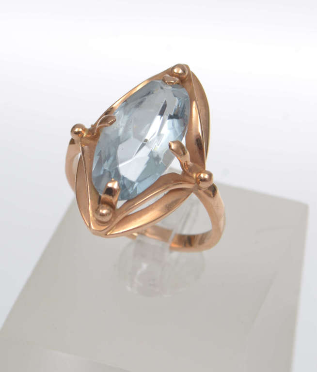 Gold ring with a blue stone