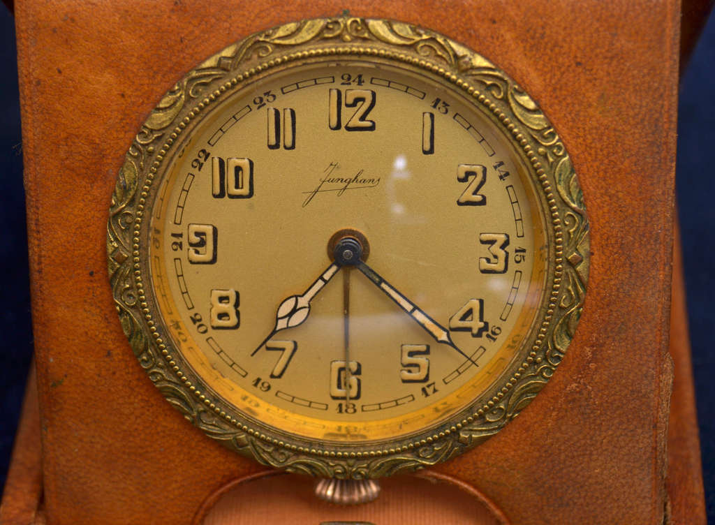 Bronze table clock in leather frame