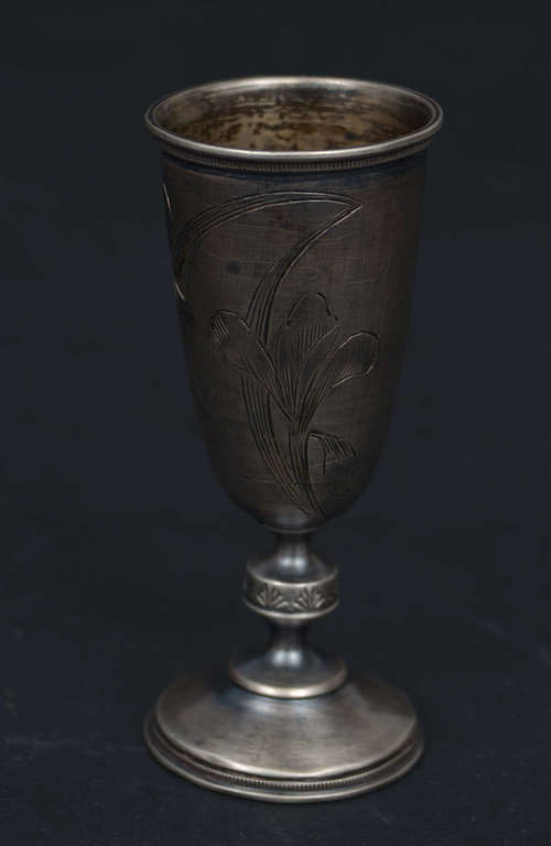Silver cup on leg