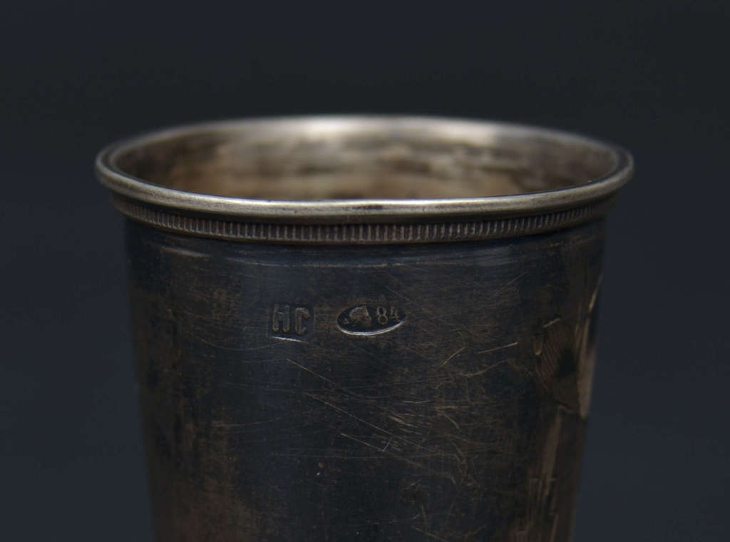 Silver cup on leg