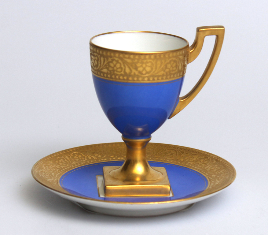 Empire style porcelain cup with saucer