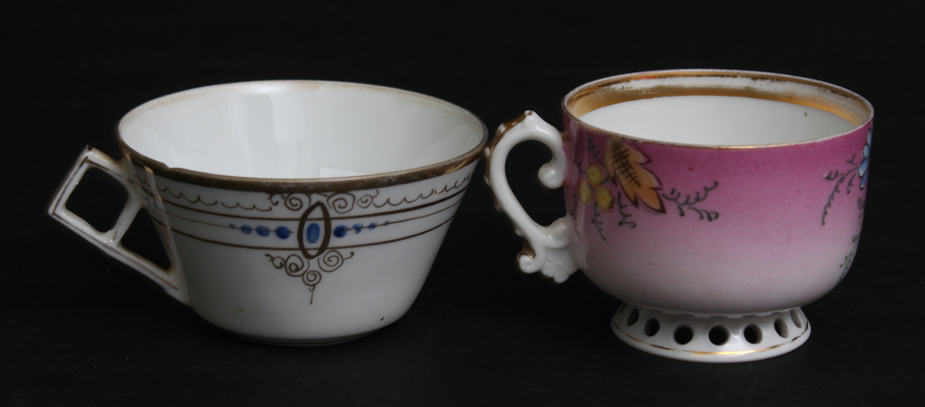 Two porcelain cups (one with defect)