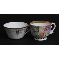 Two porcelain cups (one with defect)
