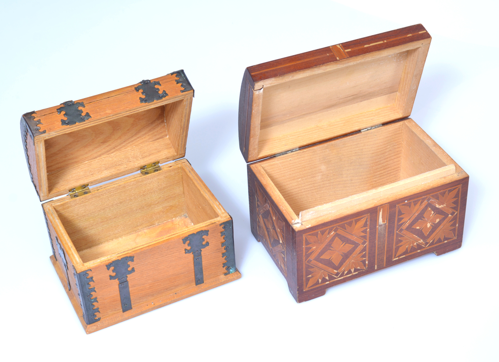 2 wooden chests with decorations