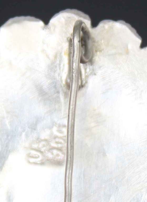 Silver Art Nouveau brooch with a gemstone