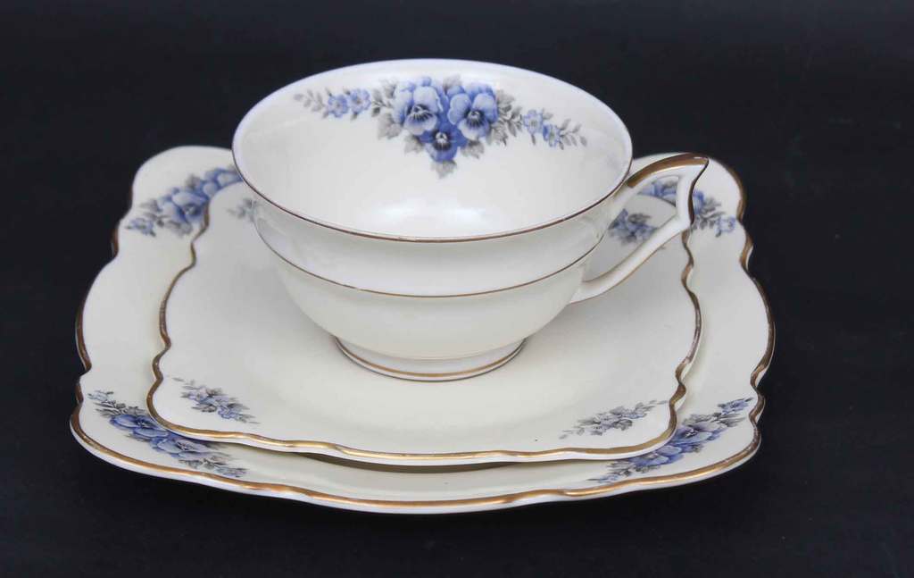 Porcelain cup with the saucer and plate