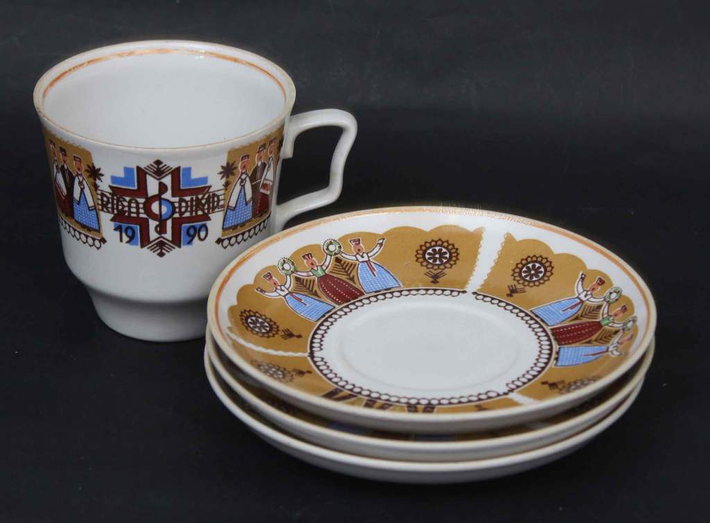 Porcelain tea cup with 3 saucers 