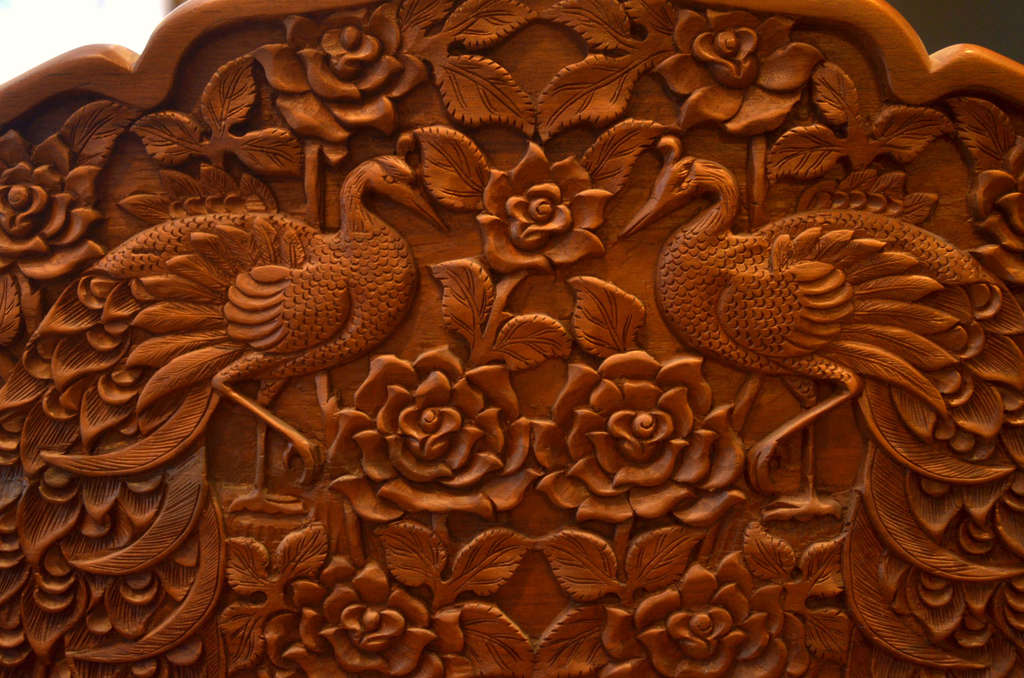 Mahogany table and chairs with wood carvings