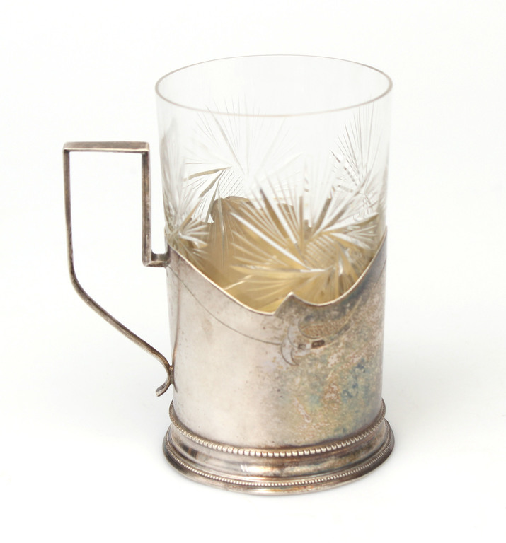 Silver glass holder with a glass
