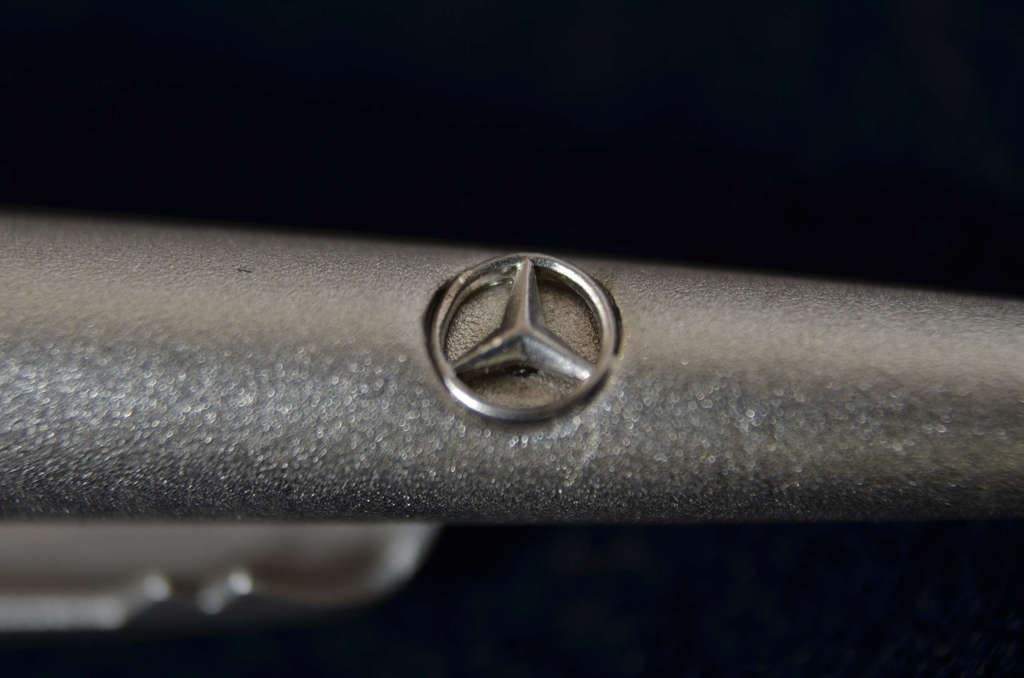 Silver brooch with the Mercedes Benz symbol