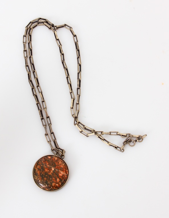 Silver pendant with chain and precious stone