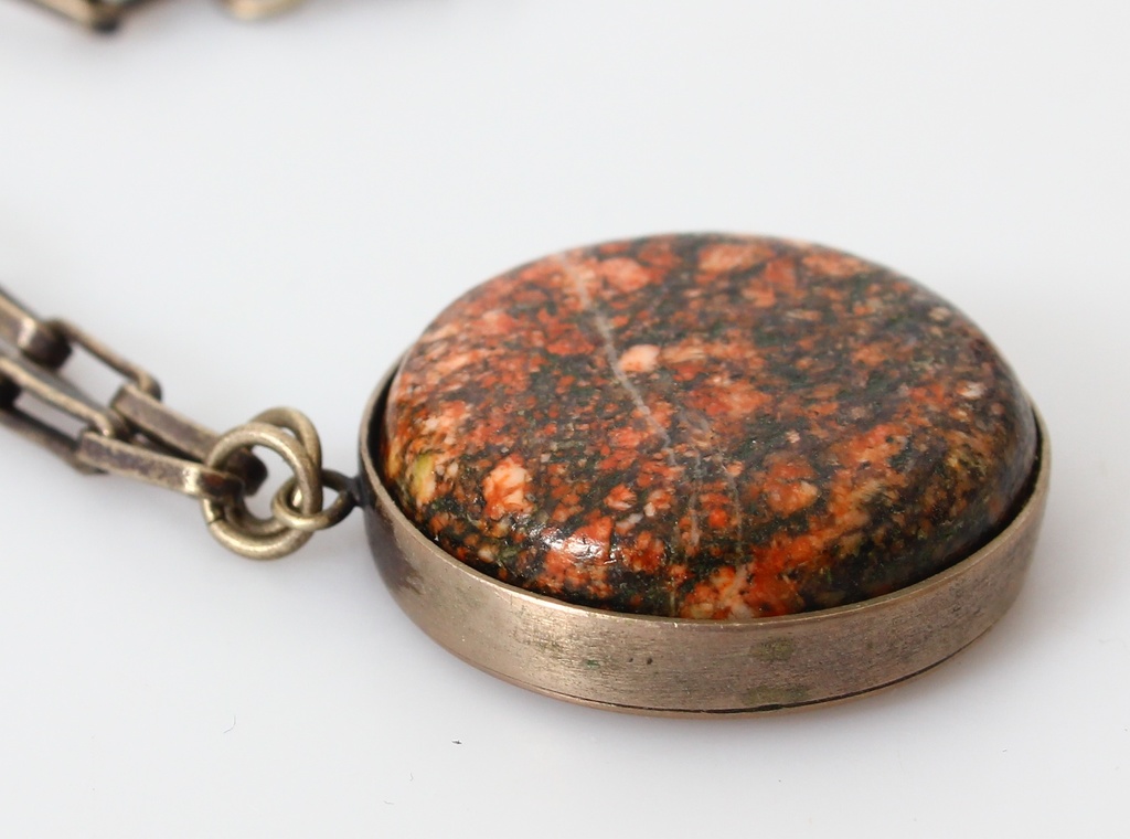 Silver pendant with chain and precious stone