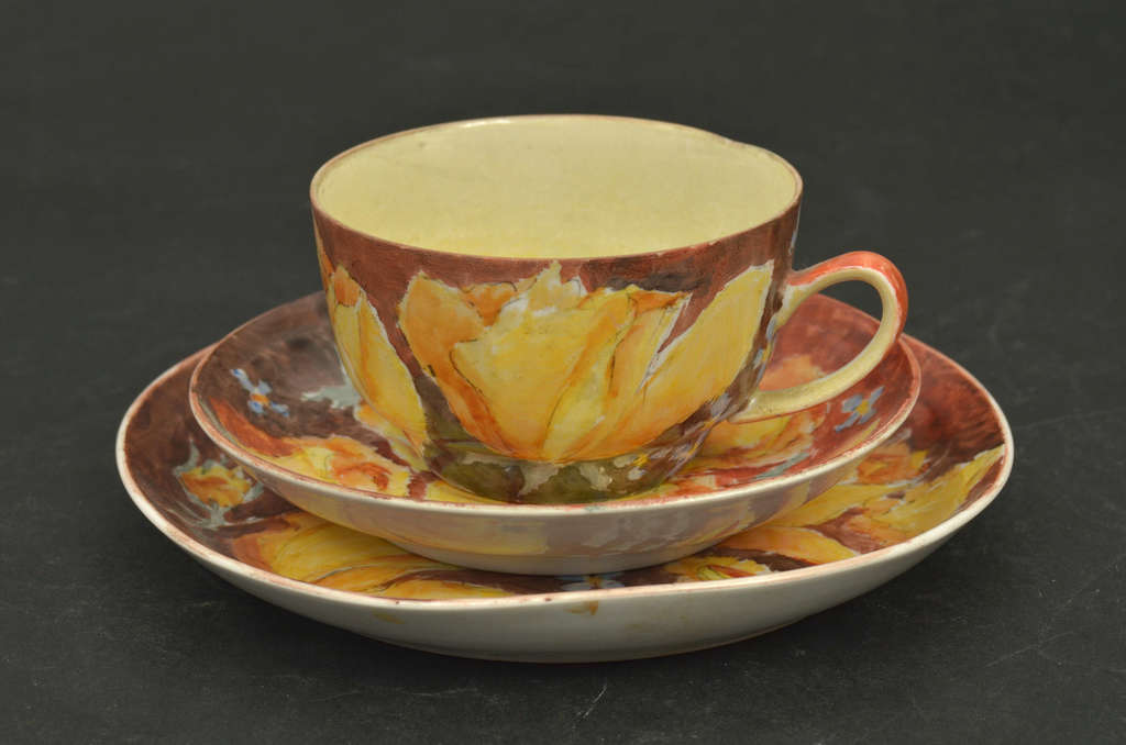 Porcelain cup with two saucers