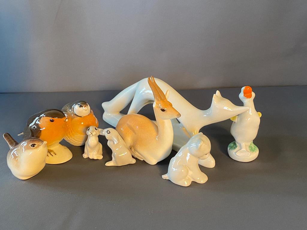 Nine porcelain figurines with smal defects