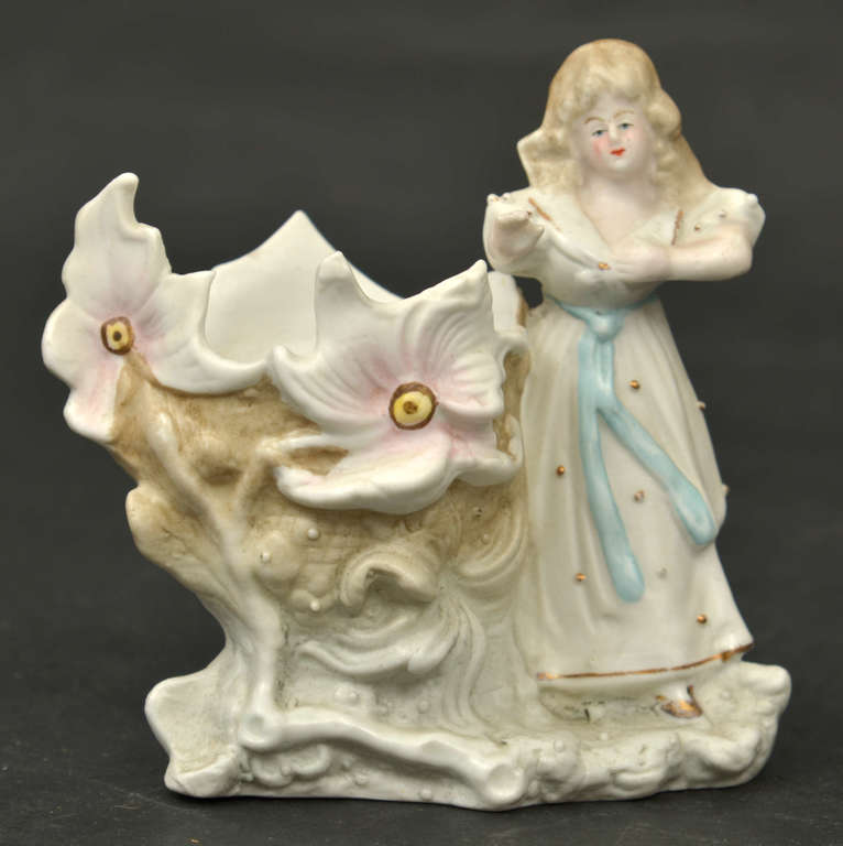 Porcelain vase with a girl's figure