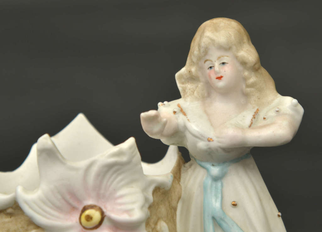 Porcelain vase with a girl's figure