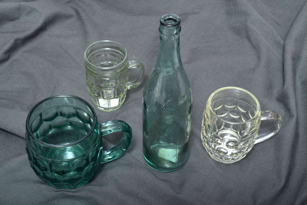 3 beer mugs and an Aldaris glass bottle