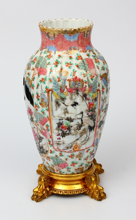 Porcelain vase on a bronze base