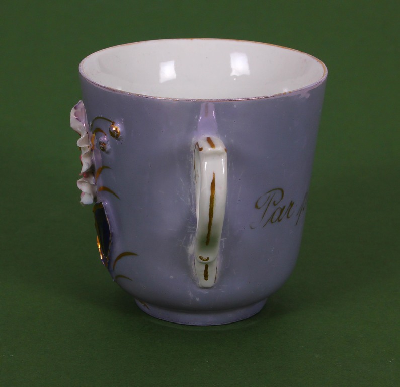Porcelain cup with flowers