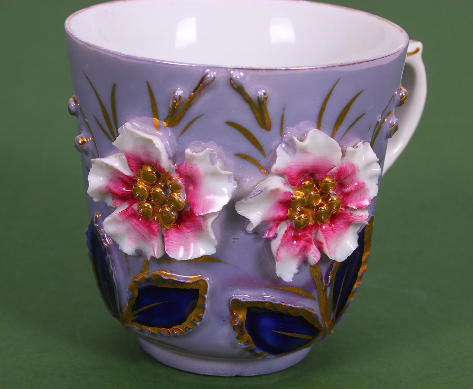 Porcelain cup with flowers