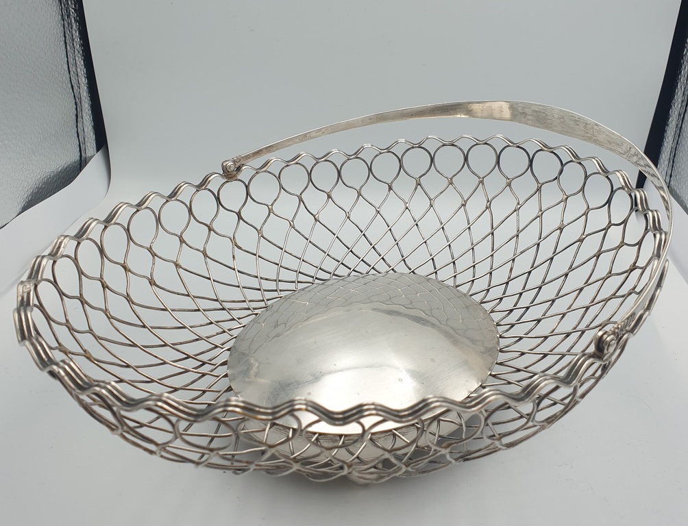 Silver fruit bowl with wooden base