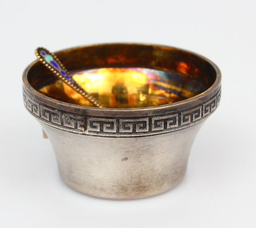 Silver spice dish with a silver spoon