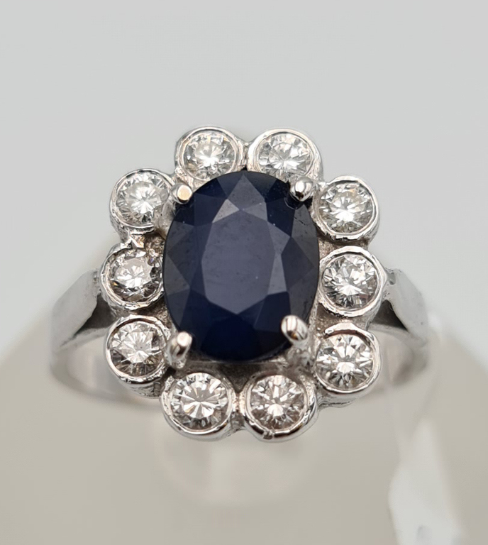 White gold ring with diamonds and sapphires