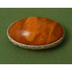 Amber brooch with silver 