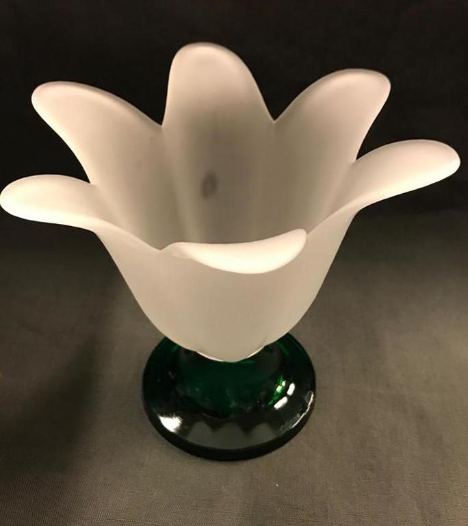 Glass vase with a green leg