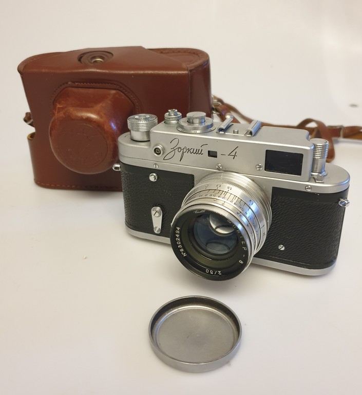 2 cameras in a leather case and an exposure meter