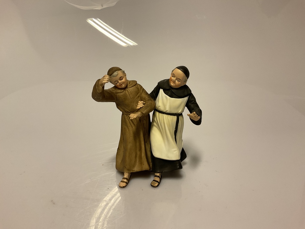 Two dancing monks