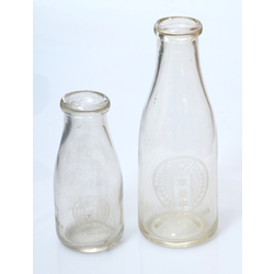Milk bottles with the coat of arms of the Latvian Dairy Farmers' Union.
