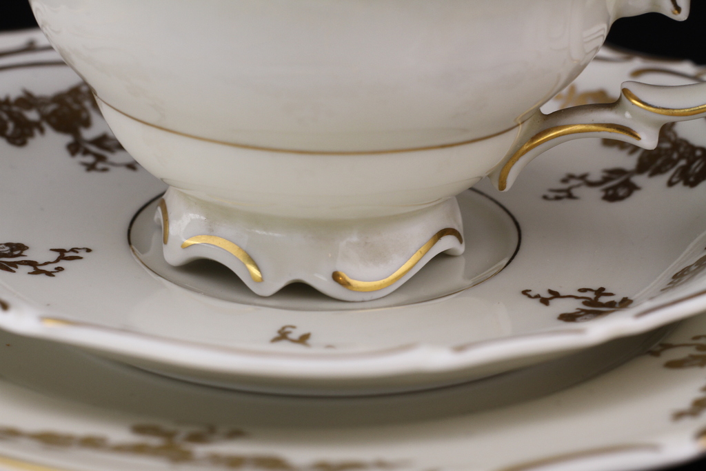 Cup with duo set of saucers