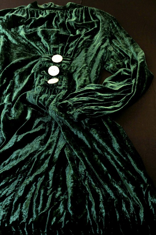 Covering the velvet dress in dark green
