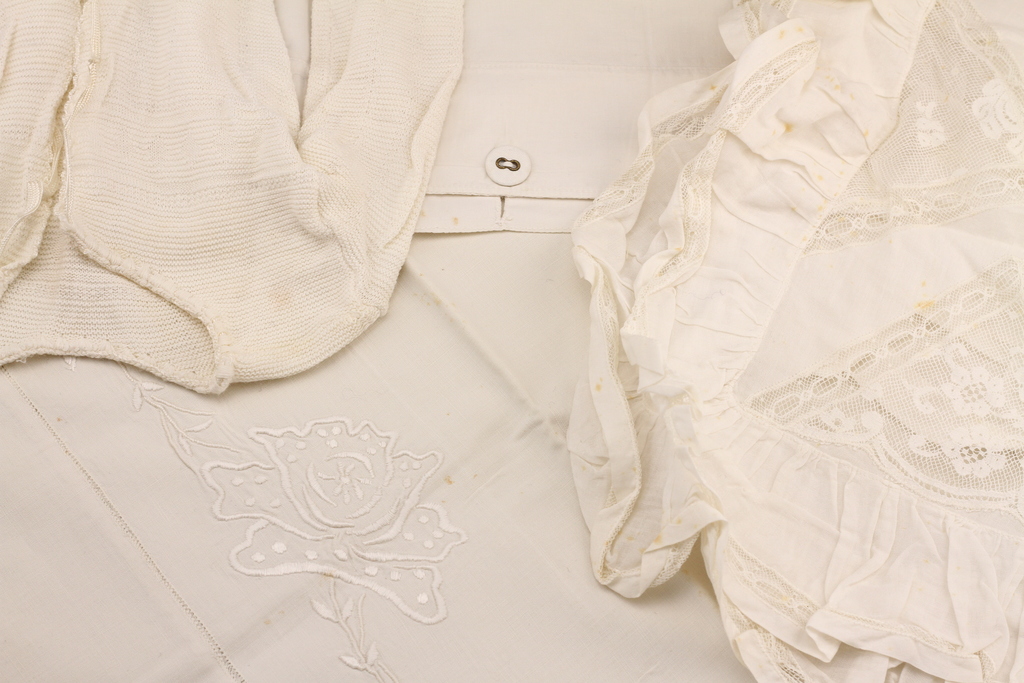 Embroidered pillowcase and other baby bedding details