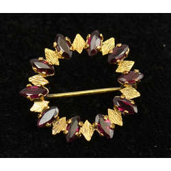 Silver Art Nouveau gilded brooch with garnets
