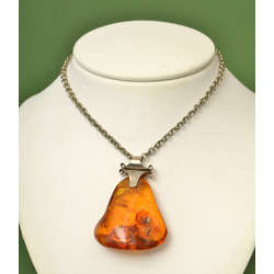 Amber pendant with a metal chain