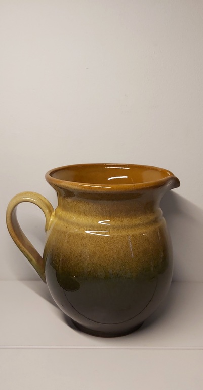 Clay pitcher. Brownish green color.
