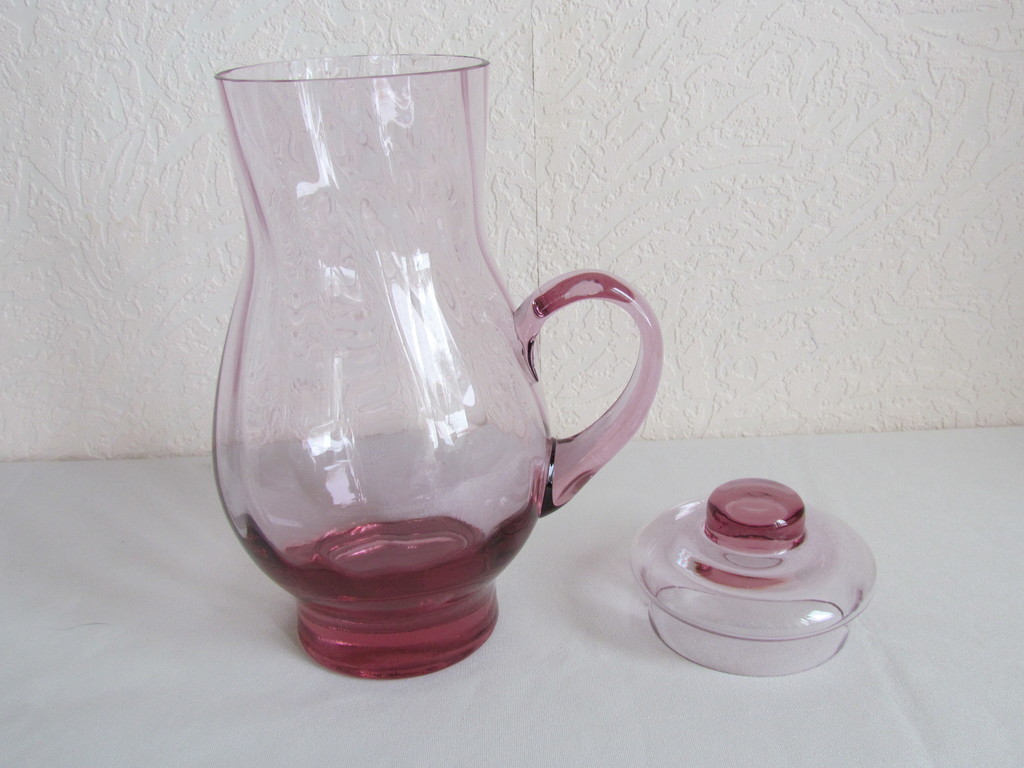colored glass pitcher with lid.
