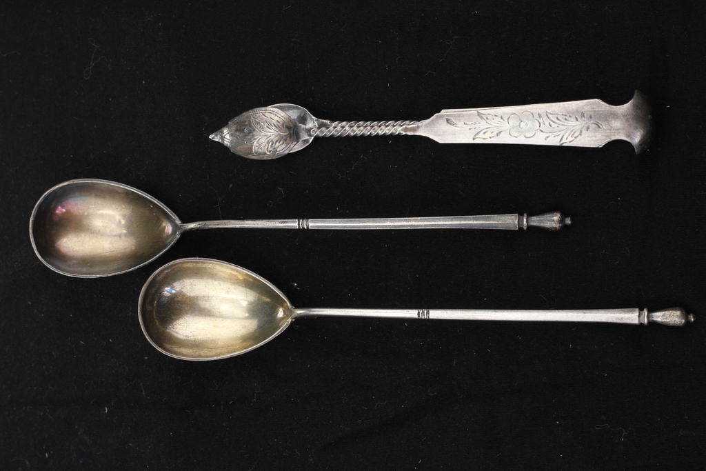 Two silver spoons and sugar tongs